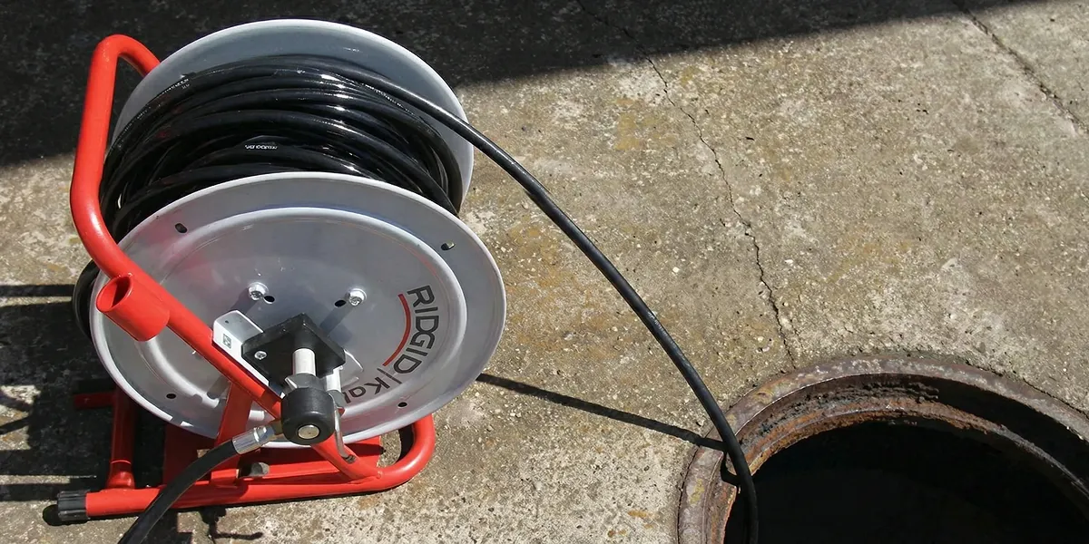 sewer rodding equipment prepared to clear clogged sewer lines in Worcester, MA